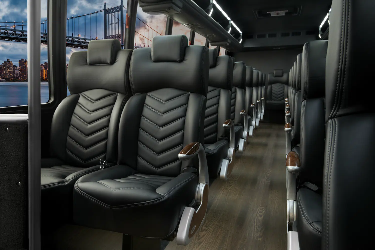 Mid coach cabin with stitched leather seats and ambient lighting