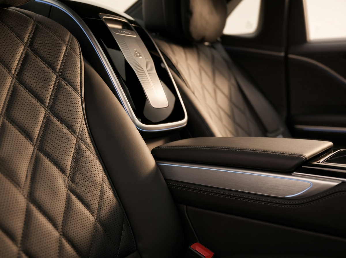 Quilted leather seat detail with brushed metal and piano-black trim