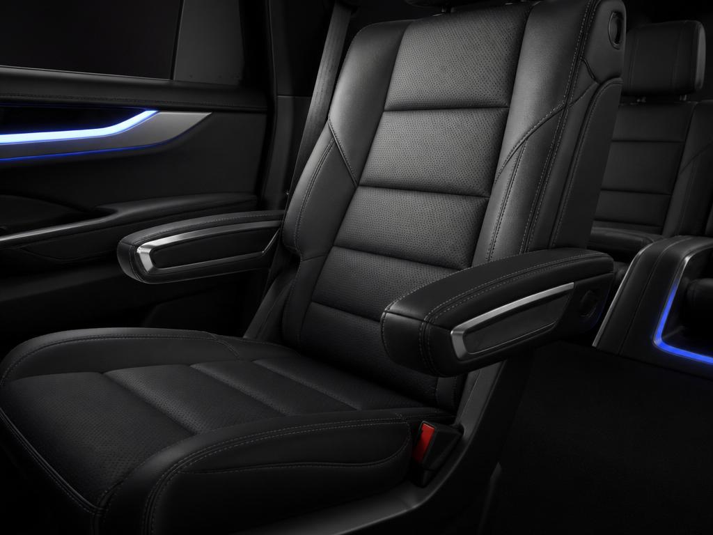 Perforated leather captain's chair detail with ambient lighting